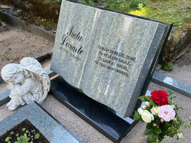 Гранитный памятник в форме книги